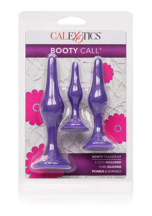 CalExotics Booty Call Booty Trainer Kit with three purple silicone butt plugs in packaging