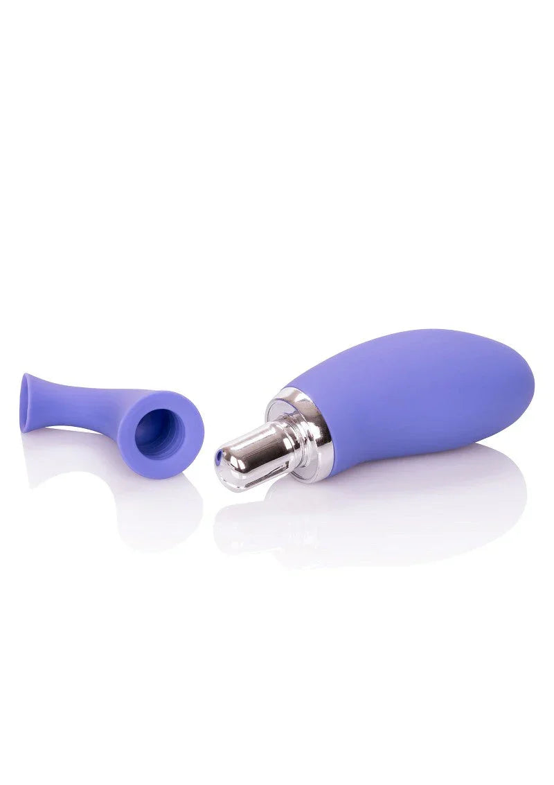 blue rechargeable clitoral pump with removable silicone suction cup on white surface