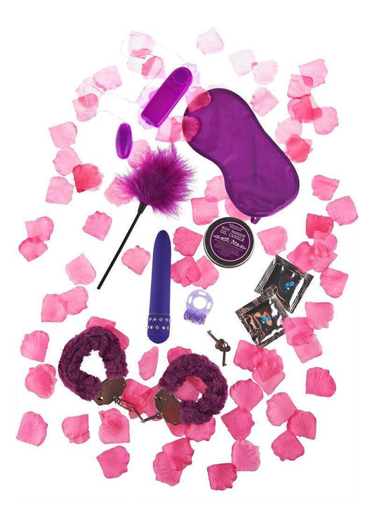 ToyJoy Just for You sex toy set with purple blindfold, handcuffs, vibrator, and rose petals