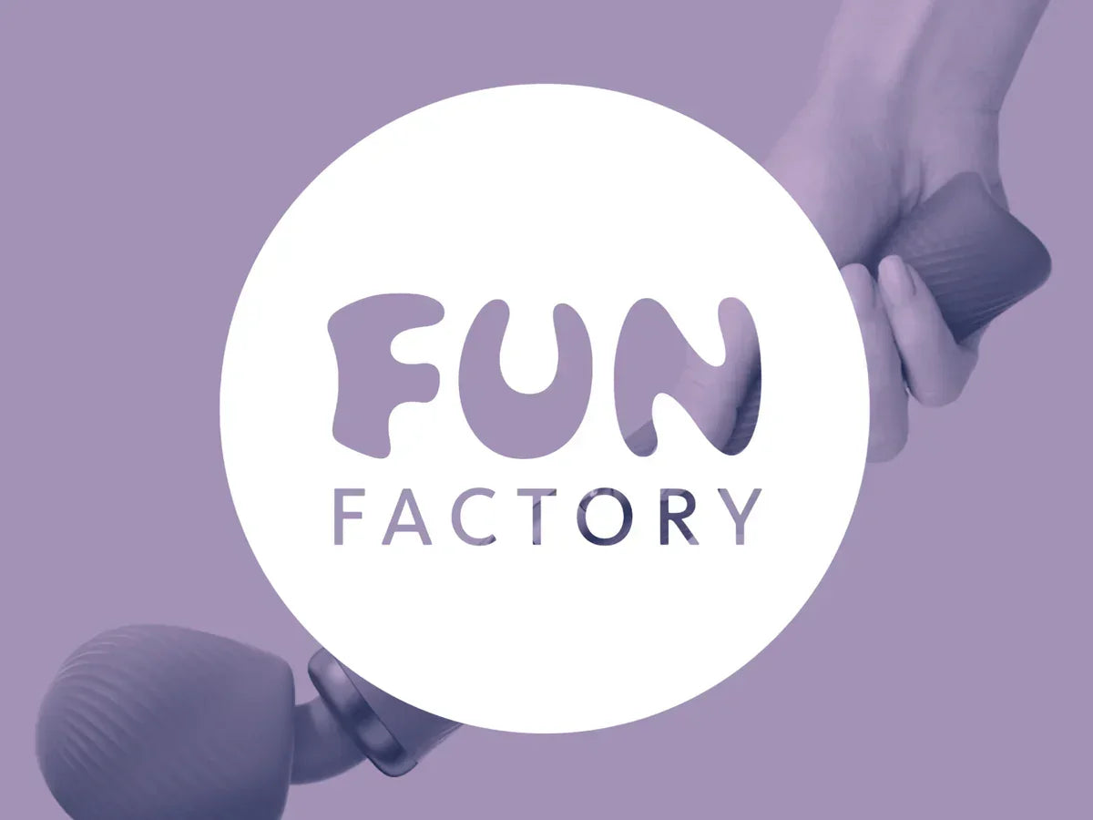 Hands holding purple tandem massage wand on lavender background with Fun Factory logo