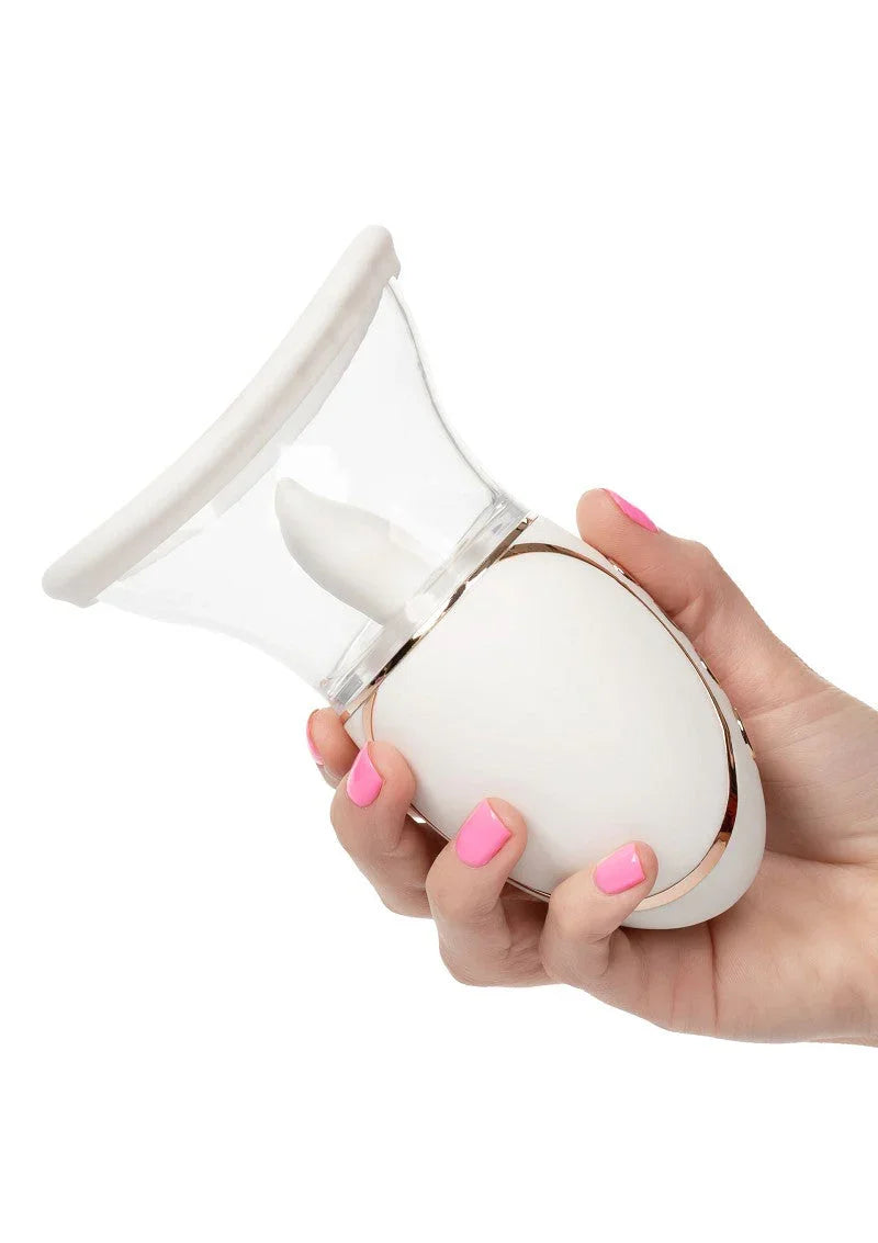 Hand holding white CalExotics Empowered Smart Pleasure Queen sex toy with pink nails