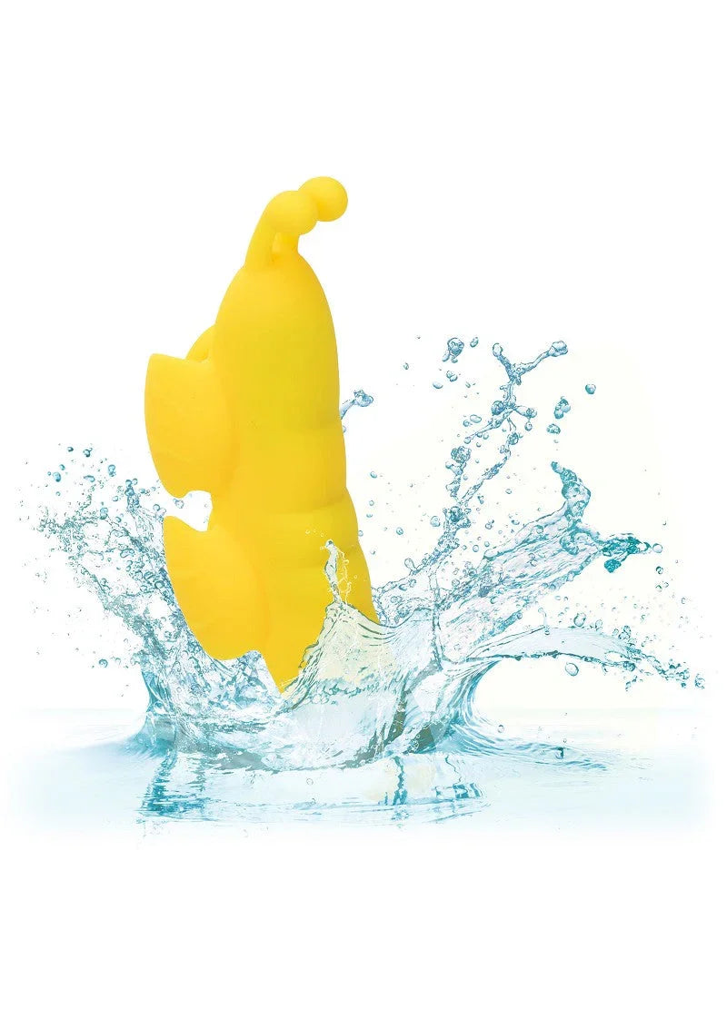 Yellow butterfly-shaped waterproof vibrator splashing into clear water on white background