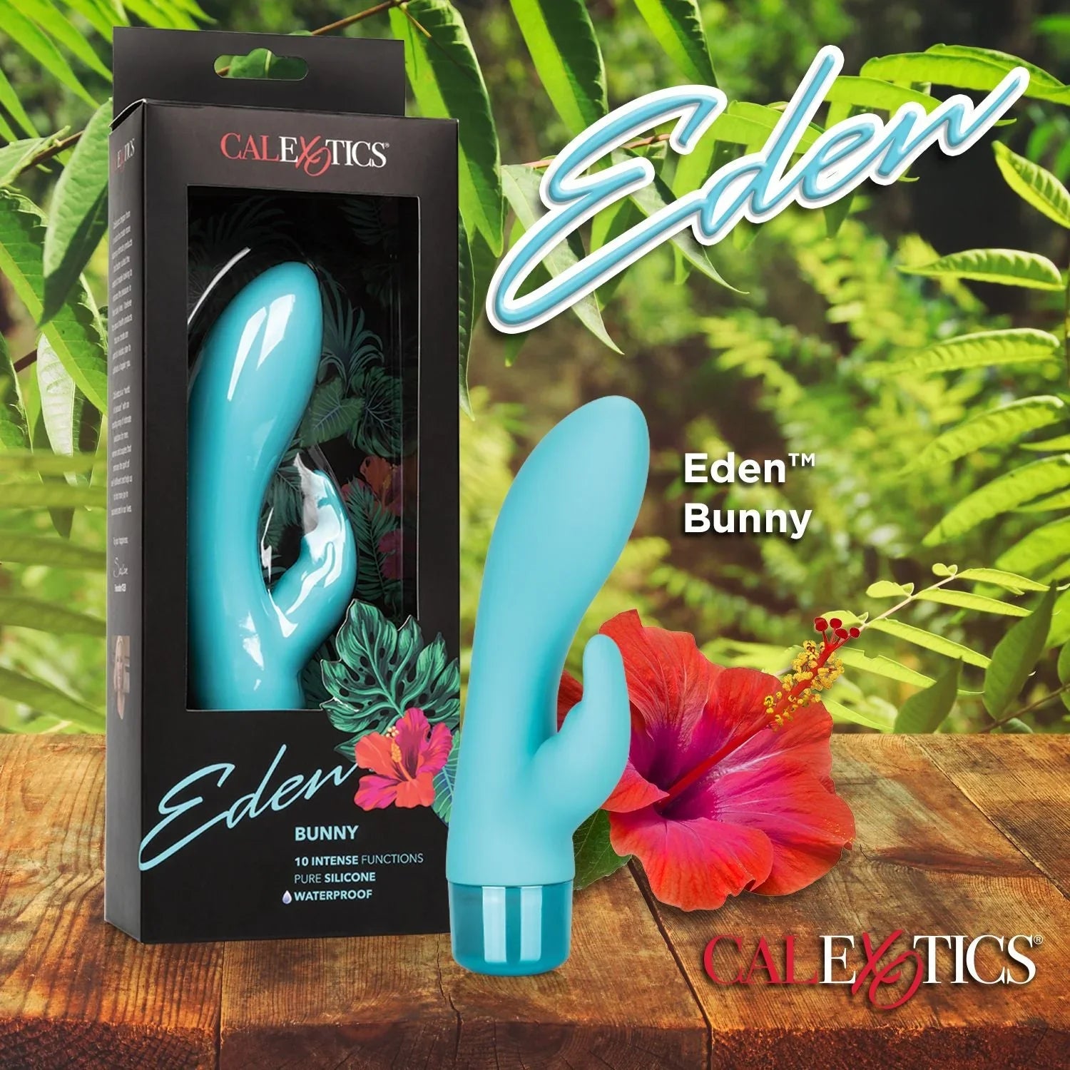 Eden Bunny blue silicone vibrator by CalExotics on wooden surface with tropical leaves and flower.