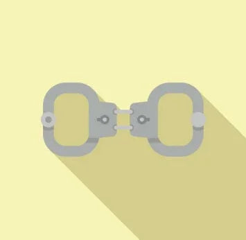 Metal handcuffs on a yellow background with a long shadow, representing restraints