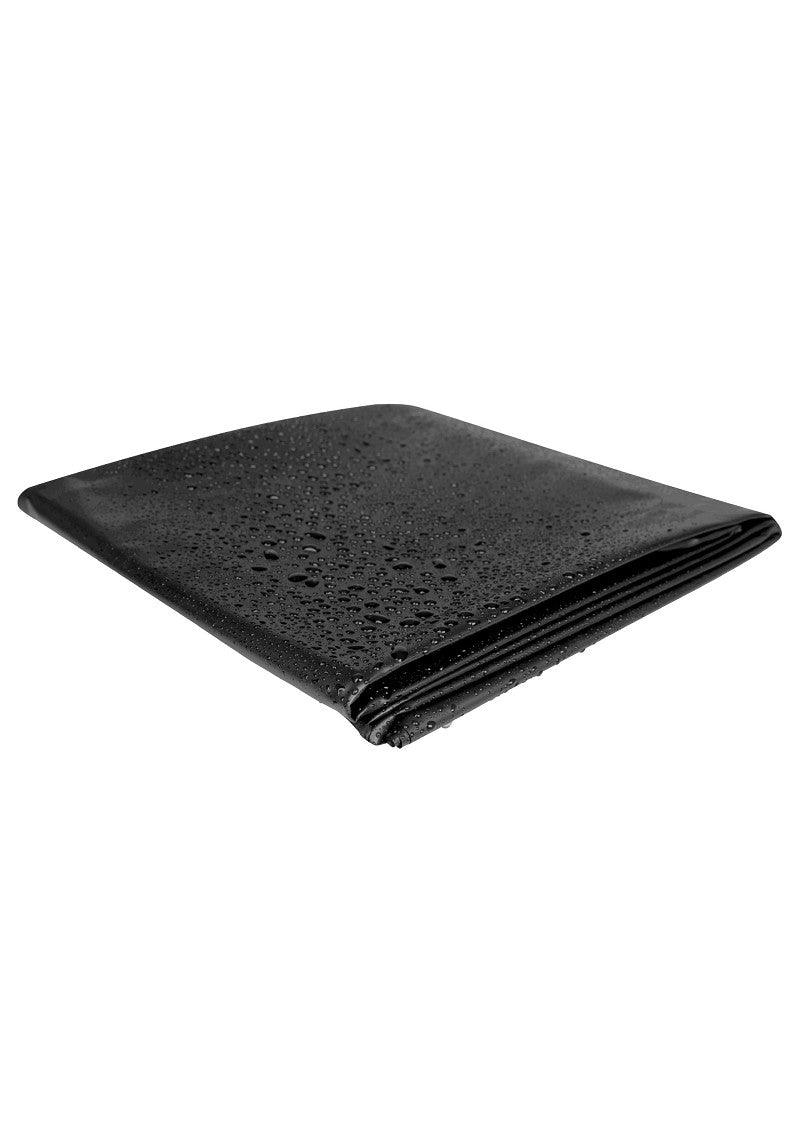 Folded black waterproof massage sheet with water droplets on surface