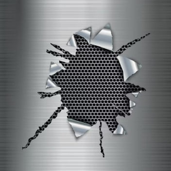 Close-up of metallic surface with torn hole revealing black honeycomb mesh beneath