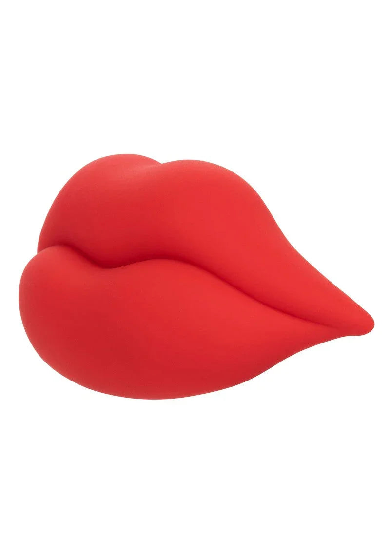 Red silicone sex toy shaped like lips on white background