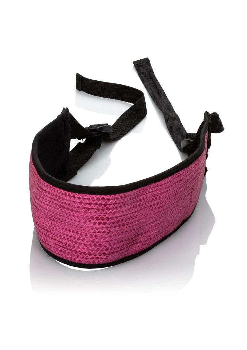 Pink and black adjustable strap blindfold for sensual and intimate use on white background