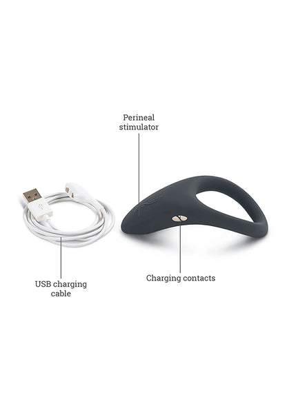 Donkerblauwe perineale stimulator met USB-oplaadkabel en laadcontacten