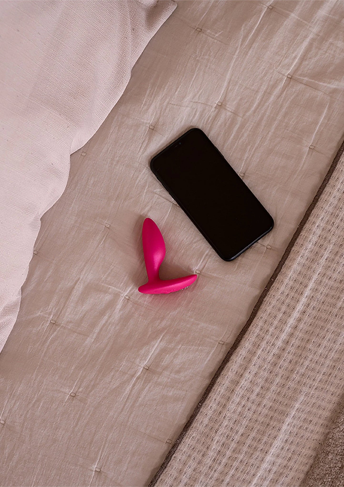 Roze anale plug met ronde punt en brede basis