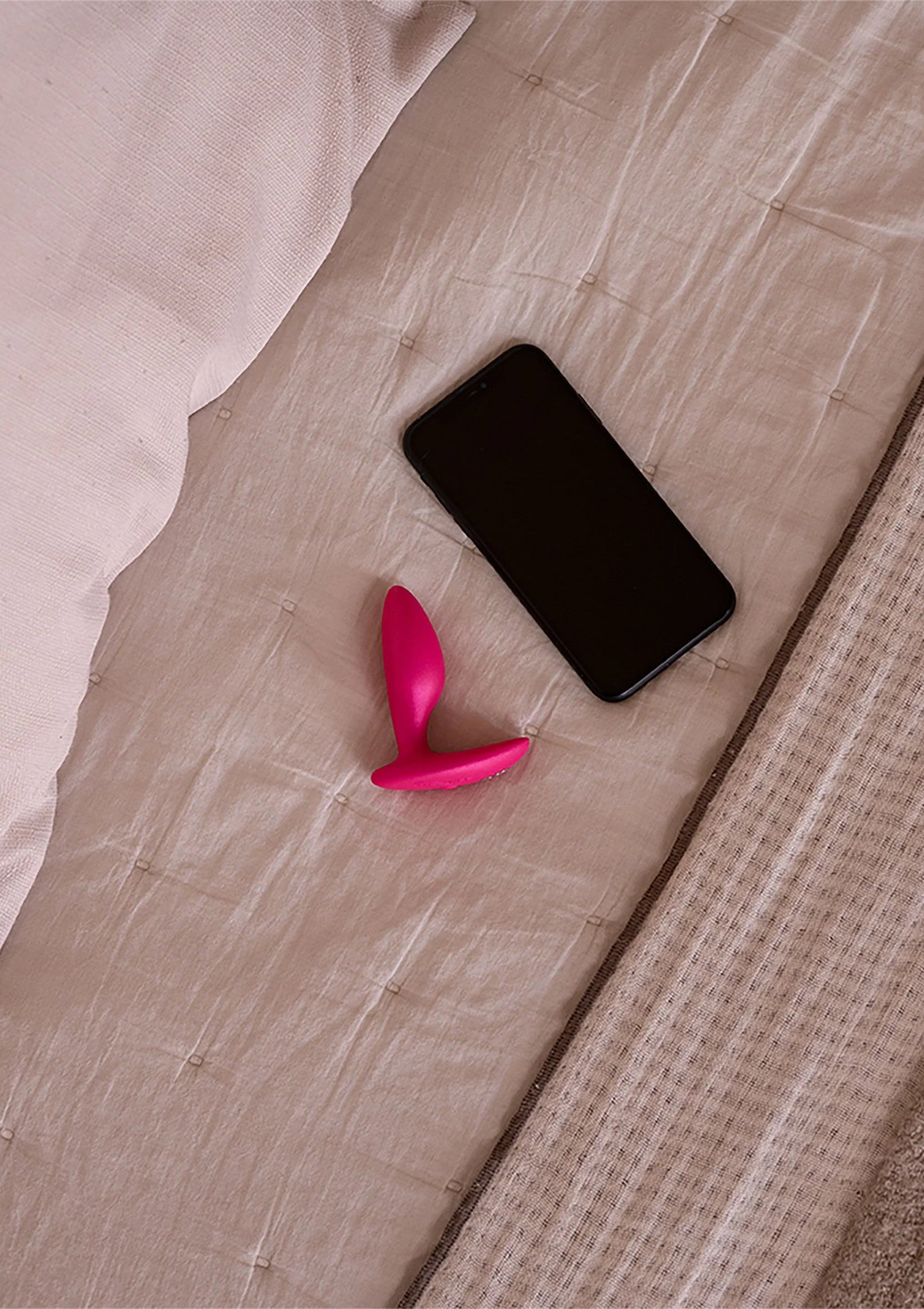 Roze anale plug met ronde punt en brede basis