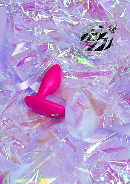 Roze anale plug met glanzende afwerking en taps toelopende steel