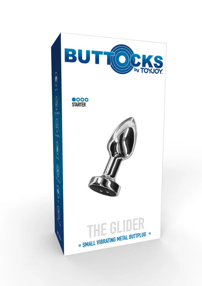 Buttocks by ToyJoy verpakking met The Glider kleine vibrerende metalen kontpropp