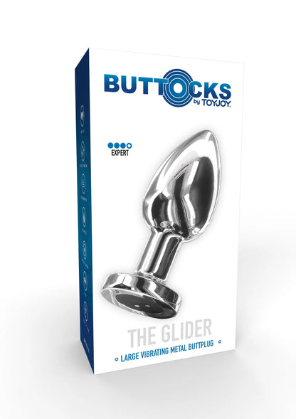 Metalen buttplug verpakt in blauwe/witte doos, glanzende zilveren top en zwarte basis