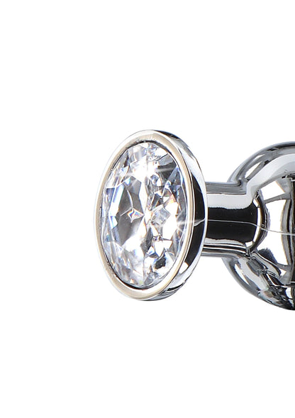 Close-up van anale plug met ovale diamantsteen in zilveren rand
