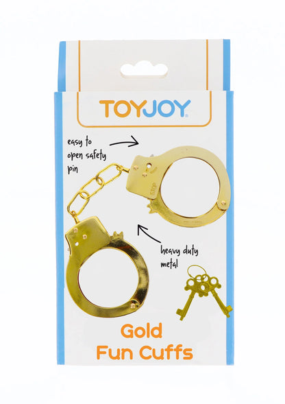 Gouden metalen handboeien met sleutelset op productverpakking