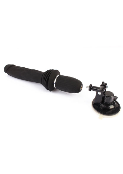 Zwarte vibrator met ribbelgreep en zuignapbasis, liggend met doprand aan de kop