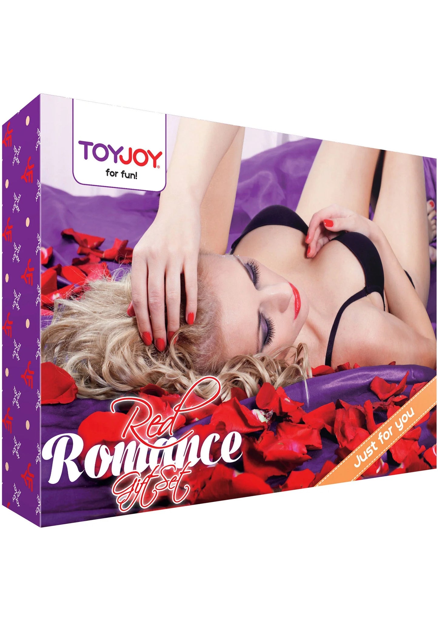 Romantische cadeauverpakking met kussen op bed en rode hartjes; tekst op de doos.