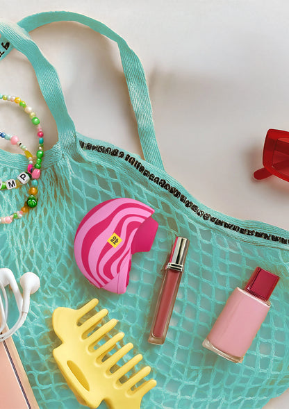 Roze Romp vibrator in turkooizen transparante opbergzak met accessoires