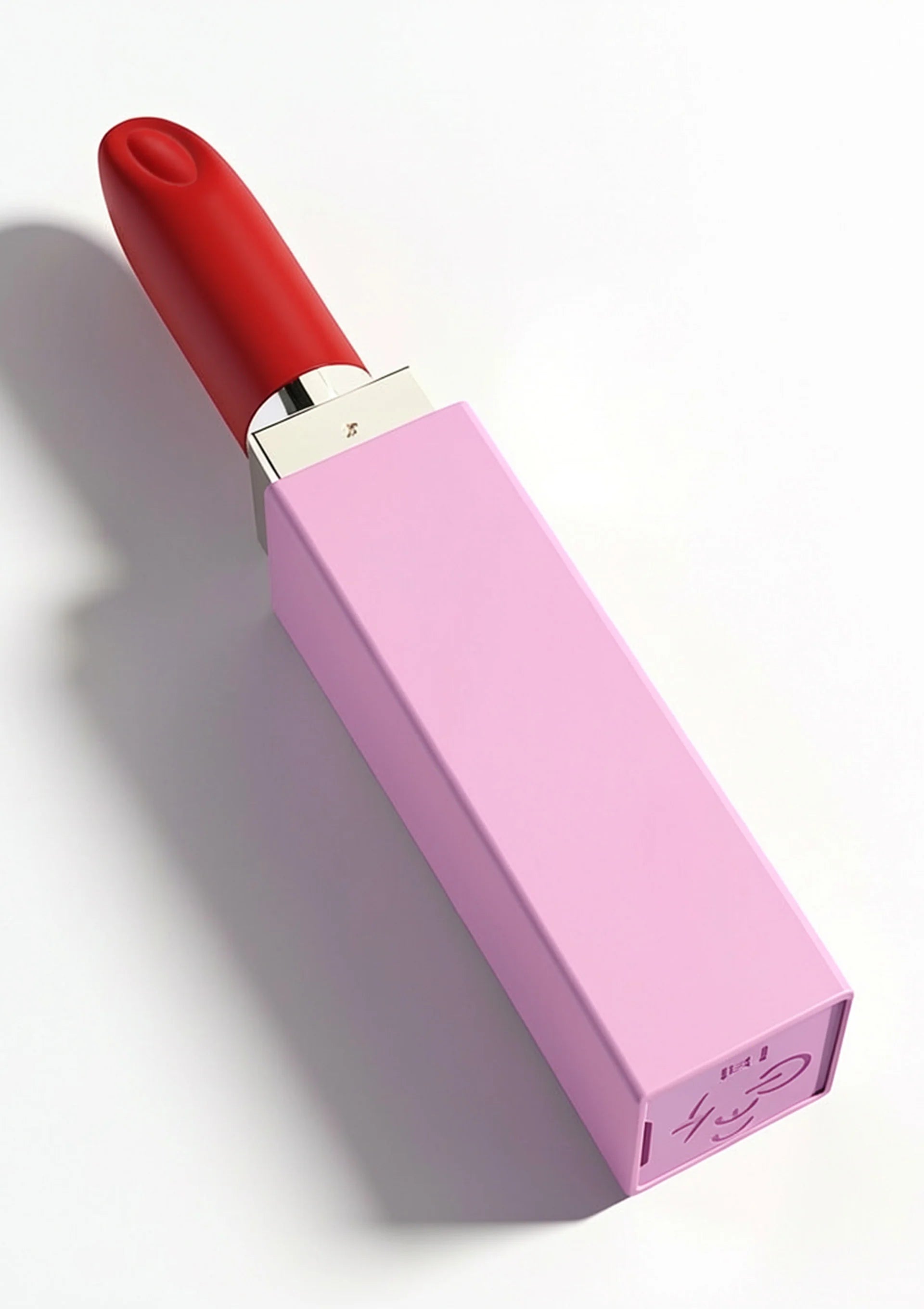Lipstick-vibrator van Xocoon in roze houder met rood opzetstuk in schuine hoek