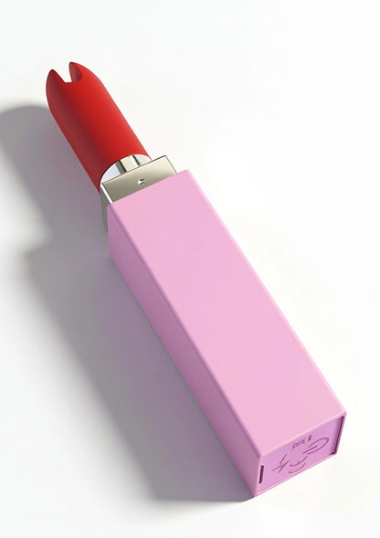 Lipstick-vibrator van Xocoon met rood opzetstuk op roze houder, zijaanzicht