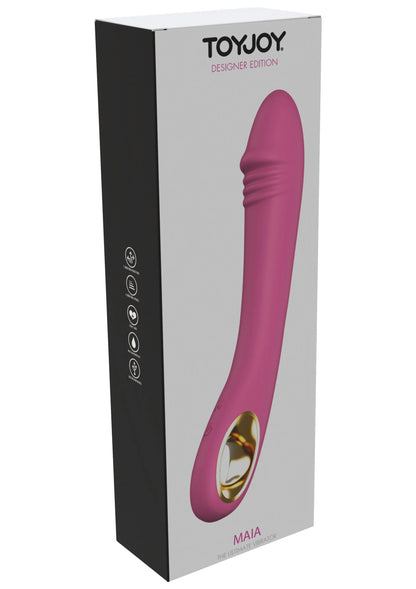TOYJOY verpakking met roze vibrator en gouden uiteinde-ring, staand afgebeeld.
