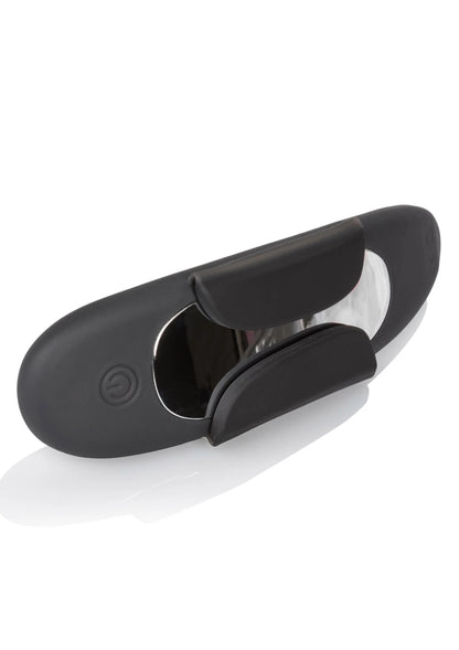 Zwarte panty teaser vibrator met klem, open binnenkant en ovale behuizing.