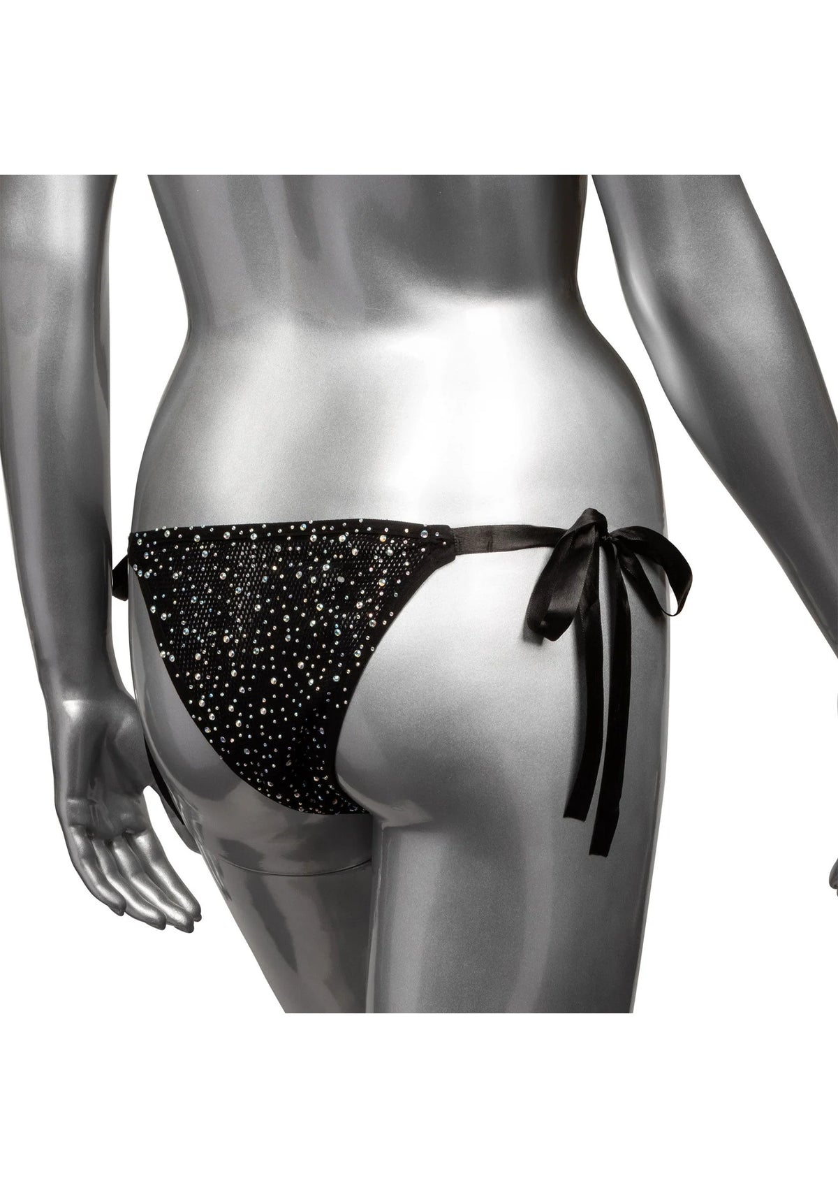 Zwarte stringpanty met glinsterende stippen en lange zijstrikbanden, close-up