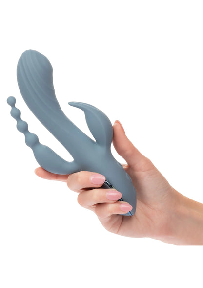 Blauwe triple vibrator in de hand, met ronde bedieningsknoppen aan de basis