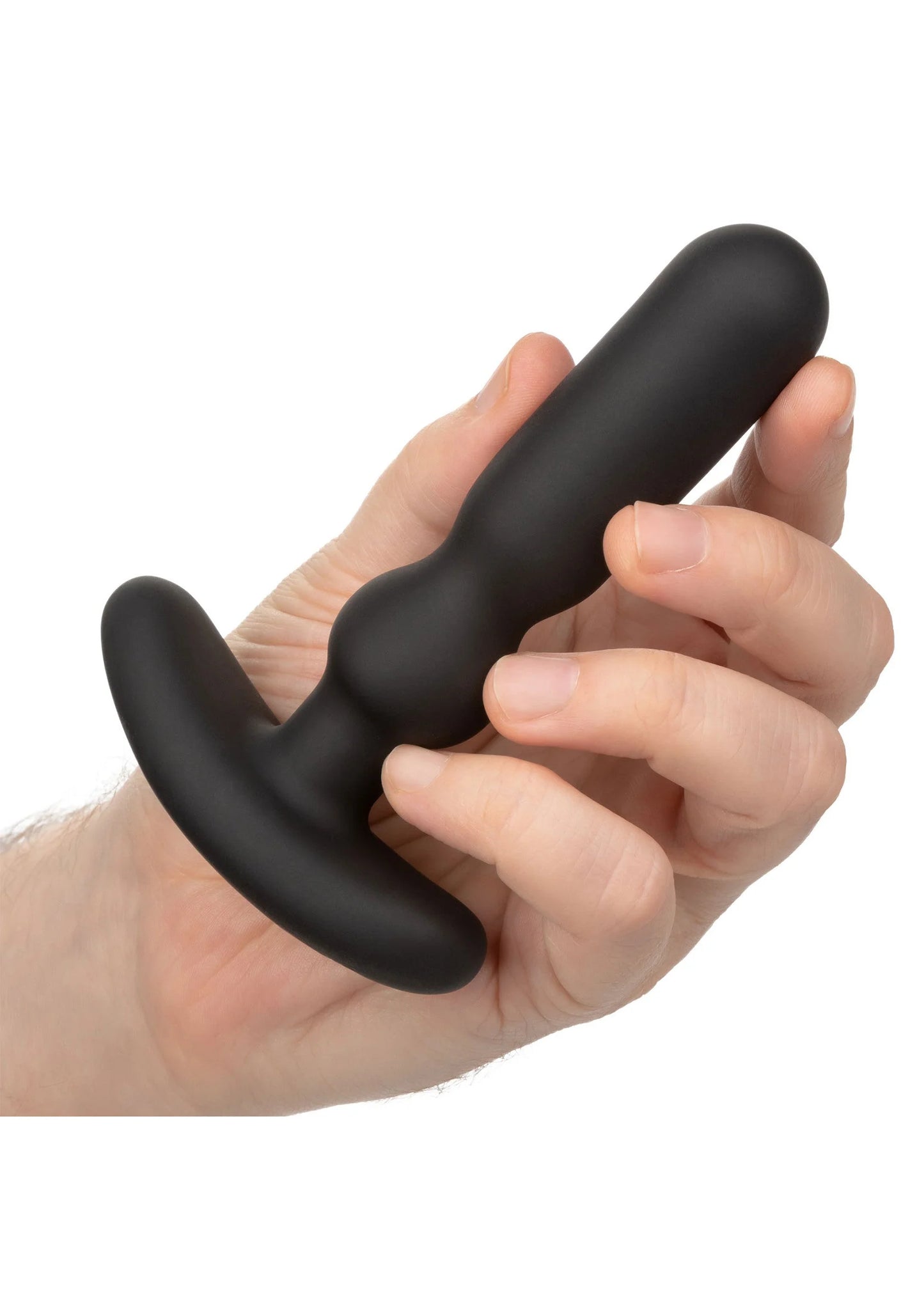 Zwarte COLT anal-T vibrator vastgehouden in hand; gebogen voet en rechte steel