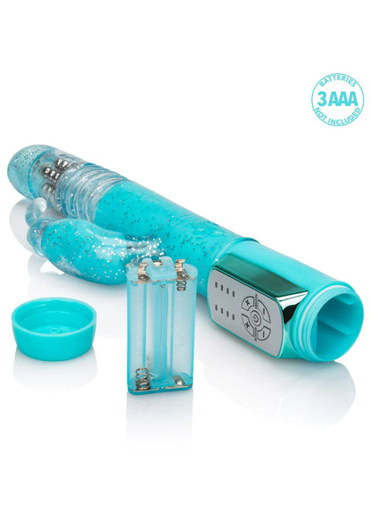 Turquoise vibrator met transparante kap, 3AAA-keurmerk en knoppenring op zijkant.