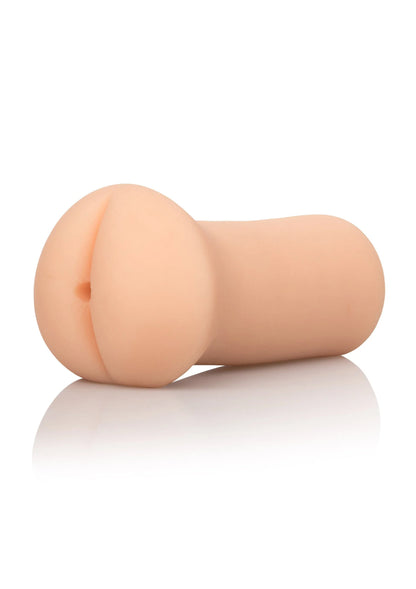 Huidkleurige masturbator met ronde opening aan één uiteinde, zijaanzicht