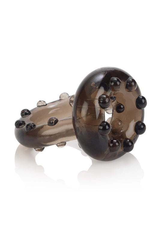 Doorzichtige bruine ring met afgeronde noppen rondom en open midden