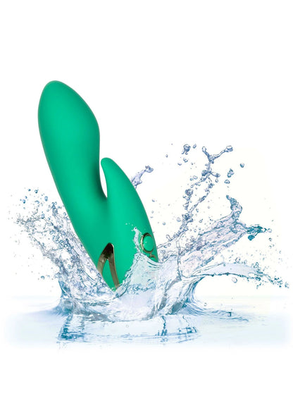 Groene vibrator met ronde kop en kleine zijopening, met spetterend water eromheen.