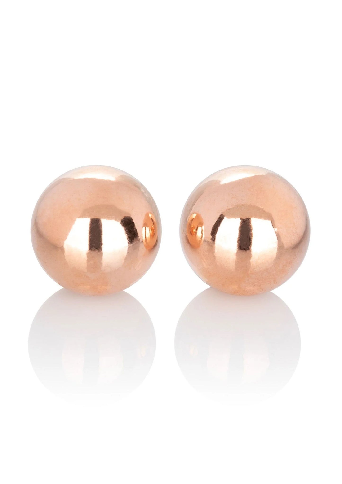 Twee rose-gouden gewogen kogels, ronde spiegelende balletjes.