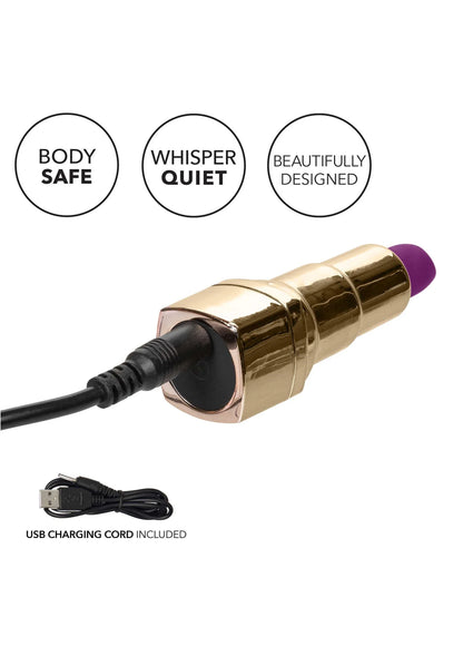 Lipstick-vibrator met gouden behuizing, paarse kop en USB-laadkabel