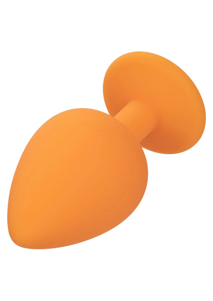 Oranje anale plugs met druppelvormige uiteinden, dicht bij elkaar