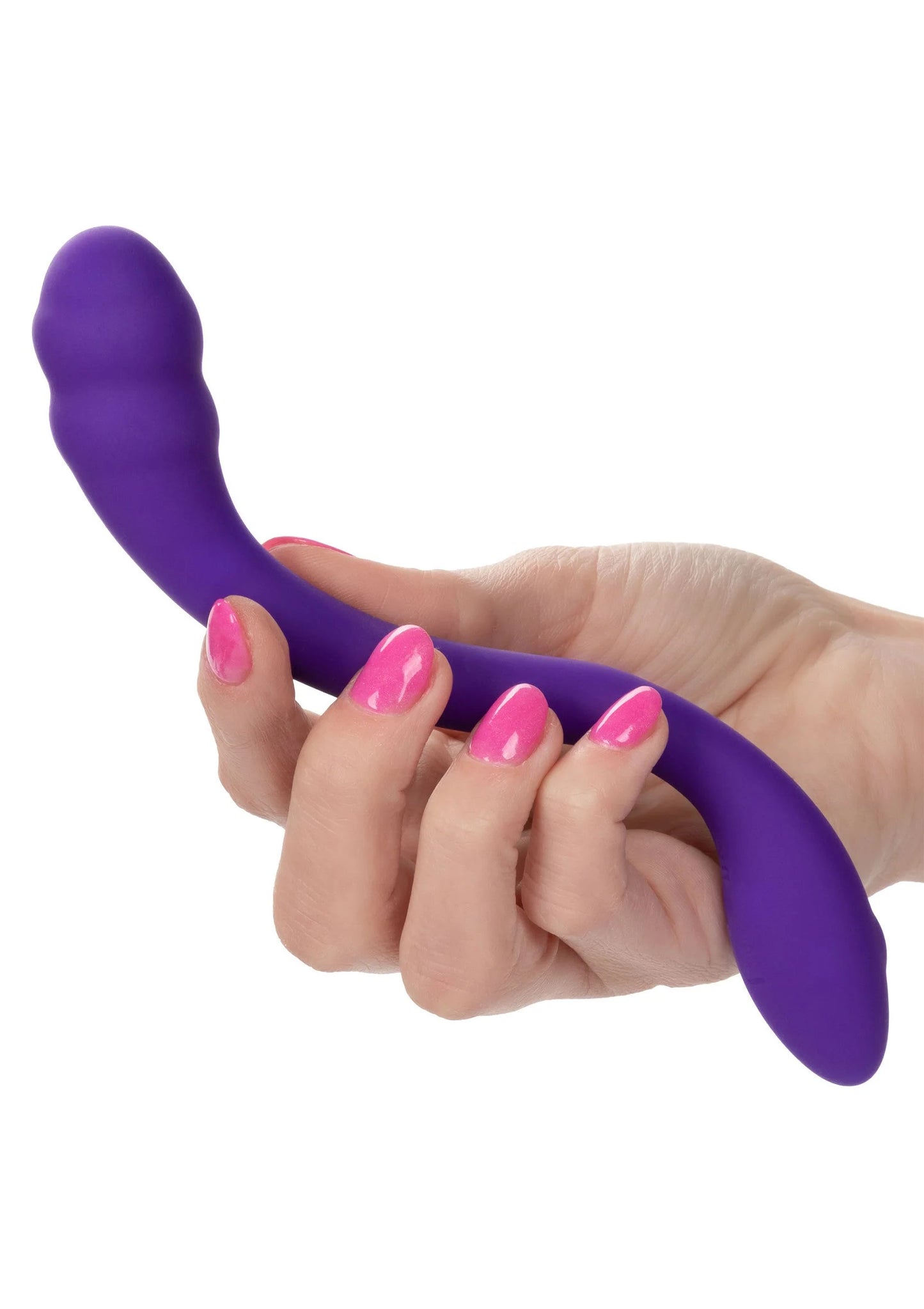 Paarse compacte vibrator in U-vorm, vastgehouden in hand