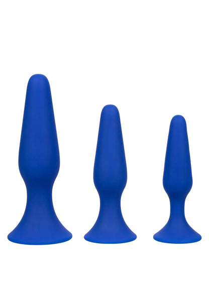 Drie blauwe siliconen anale trainer plugs met brede voet en ronde vorm