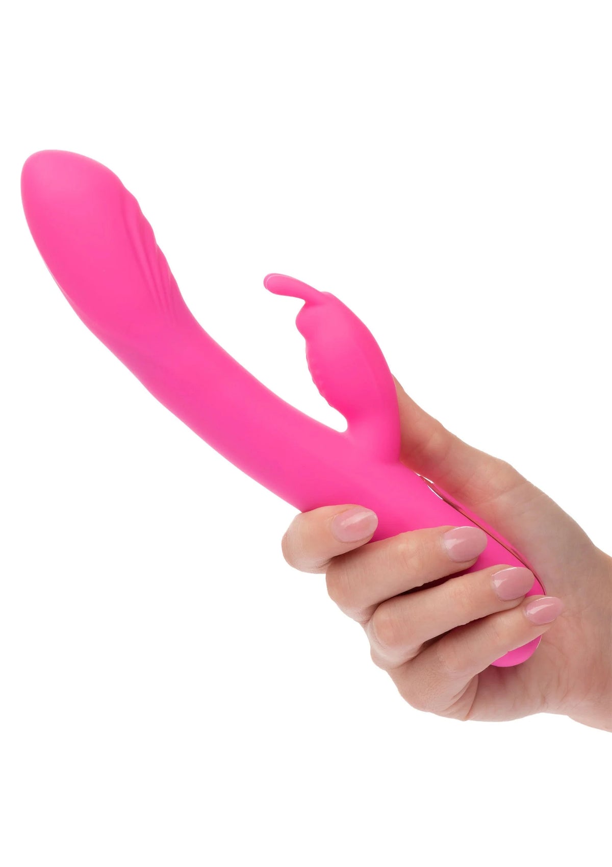 Roze rabbit-massager in hand met zichtbare vibratieknop op de zijkant