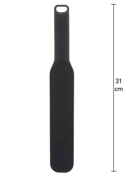 Zwarte spiked paddle met noppenstructuur op het brede deel en ophangoog bovenaan.