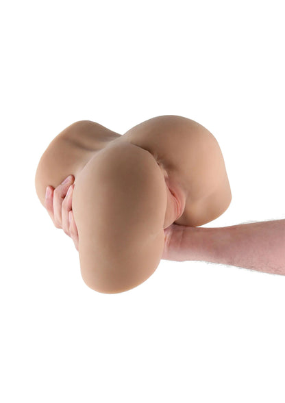 Vlees-kleurige masturbatiehulp met twee ronde vormen en hand tegen opening