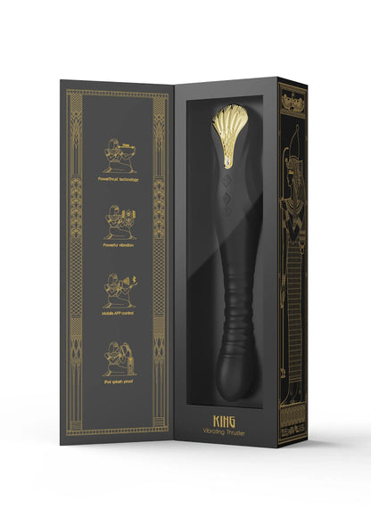 Zwarte productverpakking met gouden details, open zicht op vibrator in doos.