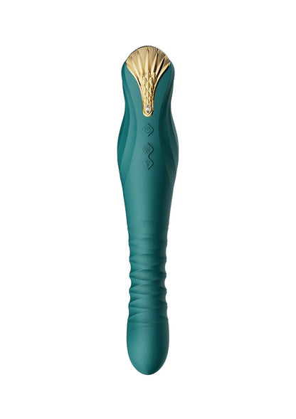 Groen seksspeeltje met goudkleurige kop en gebogen uiteinde.