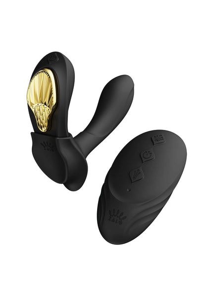 Zwarte wearable vibrator voor- en achteraanzicht met goudkleurige kop