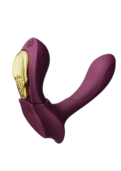 Draagbare vibrator Zalo bordeauxrood, U-vormig ontwerp met gouden accent binnenzijde.