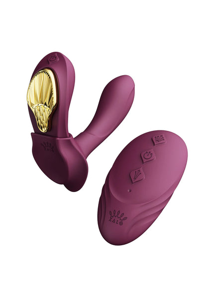 Draagbare vibrator in mauve met twee gebogen armen en bedieningsknoppen