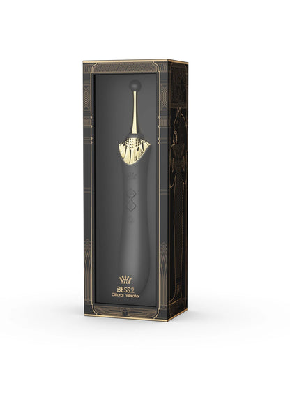 Doos van clitorisvibrator met afbeelding van de zwarte vibrator en gouden details