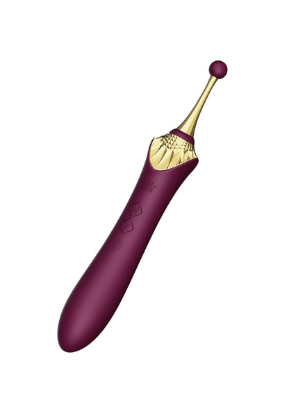 Paarse clitorale vibrator met gouden top en ronde knoop aan de uiteinde