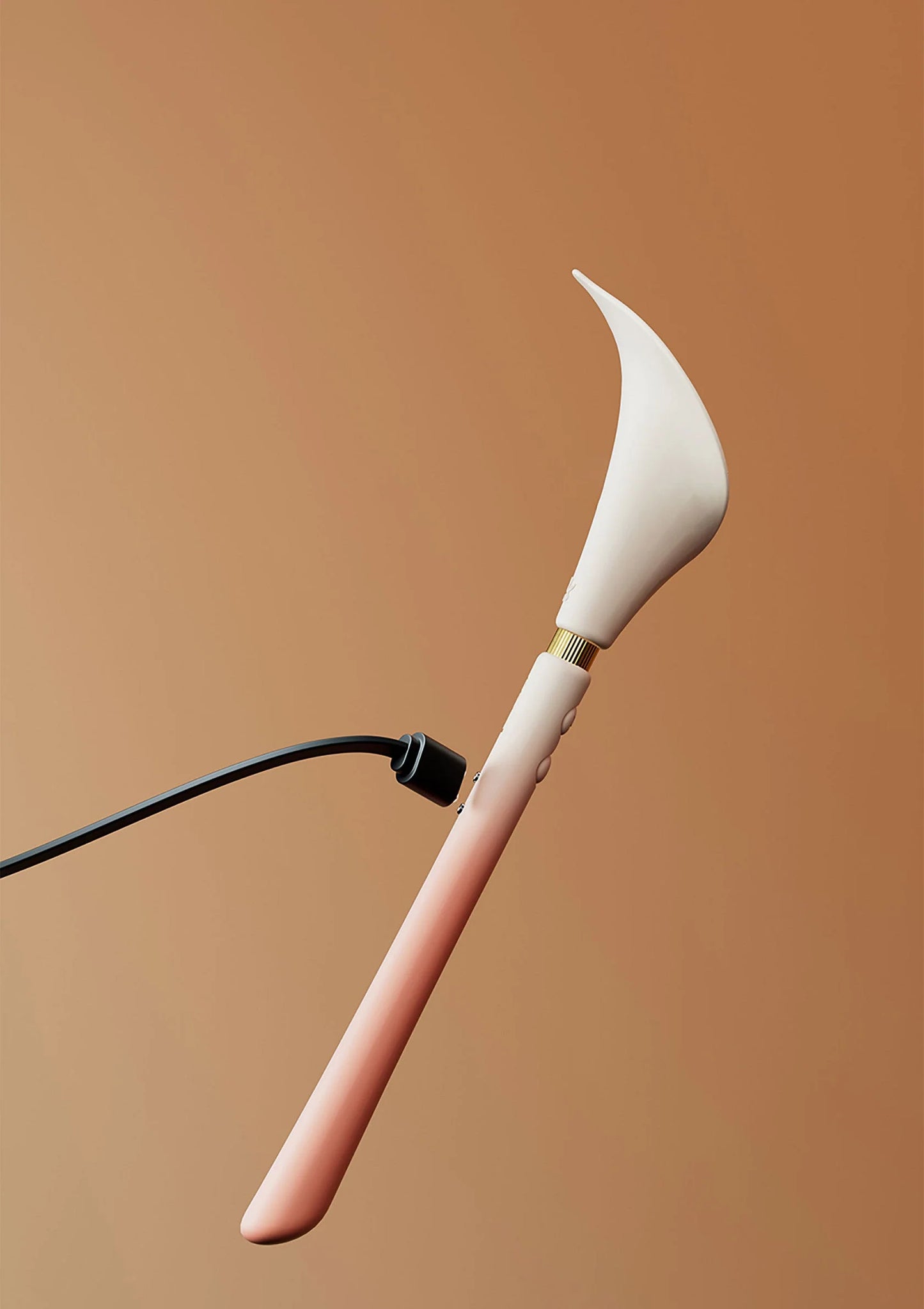 Calla-trilstimulator met witte bloemkop en handvat met kabelaansluiting